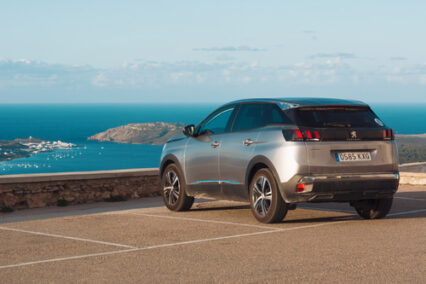 Peugeot 3008 SUV car parked on the top of El Toro Mountain on Menorca, Balearic Islands, Spain