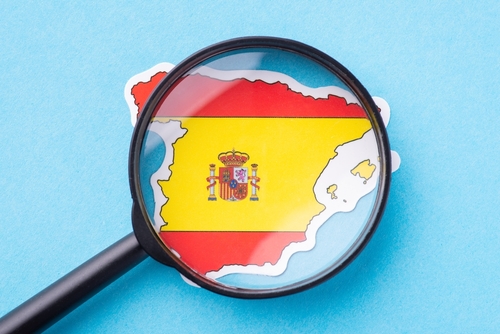 Concept of studying Spain. Magnifying glass on map of Spain