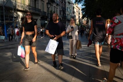 People is seen shopping in the city downtown and shopping street Carrer de l'Angel in Barcelona, Spain