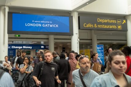 People queue to check in for flights at London Gatwick Airport, South Terminal, UK.