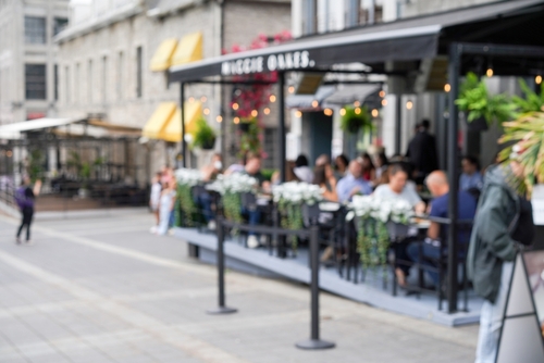 People dining outdoors in Old Montreal.