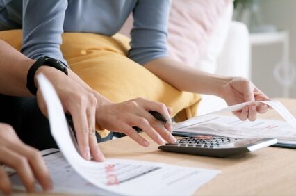 Young adult couple discuss past due bill