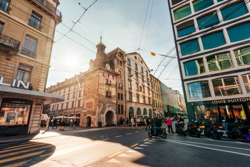 Contemporary building exterior with brand name store, tram transport and street view in shopping centre