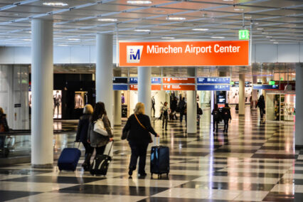 Passengers walking through Munich Airport Center