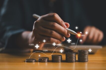 Businessman calculating income and return on investment