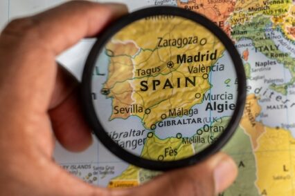 Close-up of Spain map under a magnifying glass