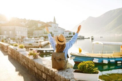 Tourist woman admiring view of colorful the view of the city.