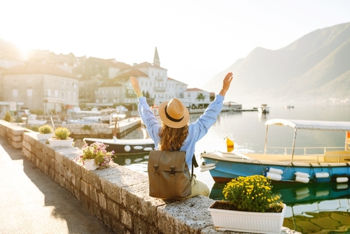 Tourist woman admiring view of colorful the view of the city.