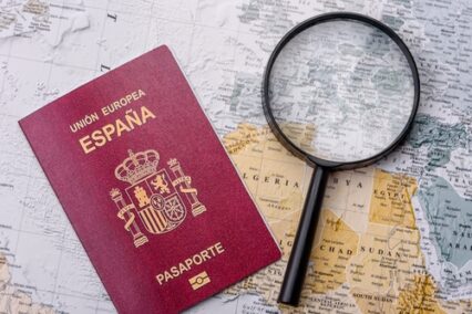 travel with passport, magnifying glass, world map and money.