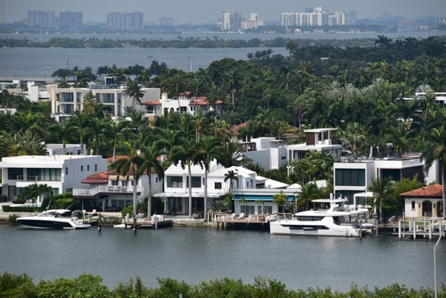 View of luxury homes on Palm Island in sunny Miami