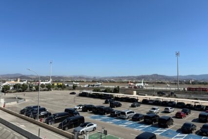 Arrivals parking lot and aircraft at Malaga Costa del Sol airport.