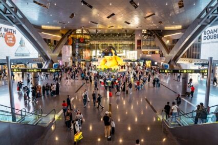 Busy terminal at Hamad International Airport during rush hour