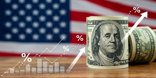 The US financial picture shows a rising arrow over the US currency