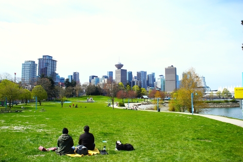 Couple having some rest in Spray park in downtown Vancouver Eastside.