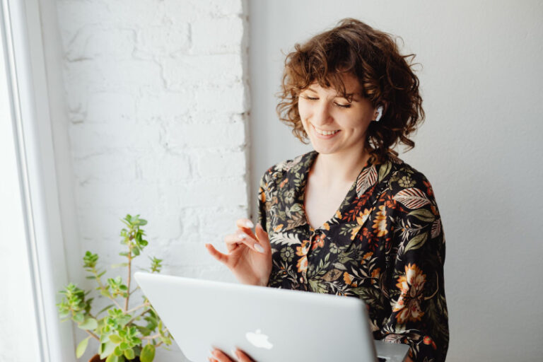 smiling woman with laptop