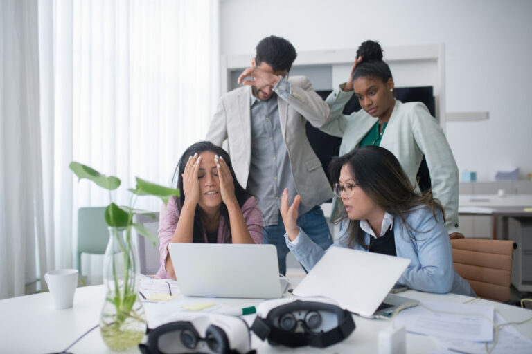 four coworkers stressed in office