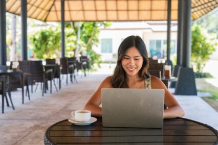 young happy woman with laptop