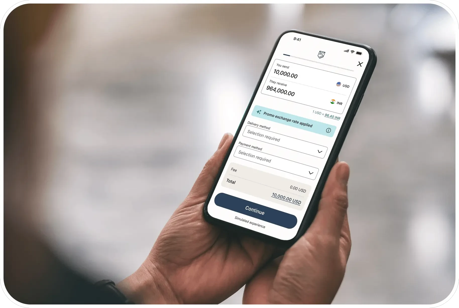 Person holding a phone showing the Remitly app sending 10,000 USD to India.