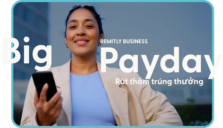 The Remitly Business Big Payday Prize Draw: a smiling businesswoman holding a phone