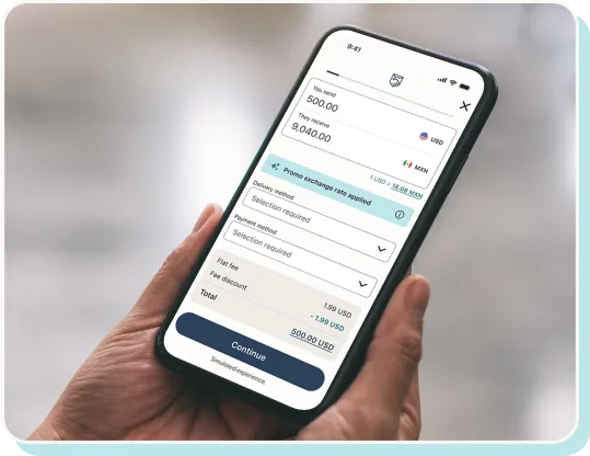 Hand holding a phone with a simulated screen of the Remitly app.