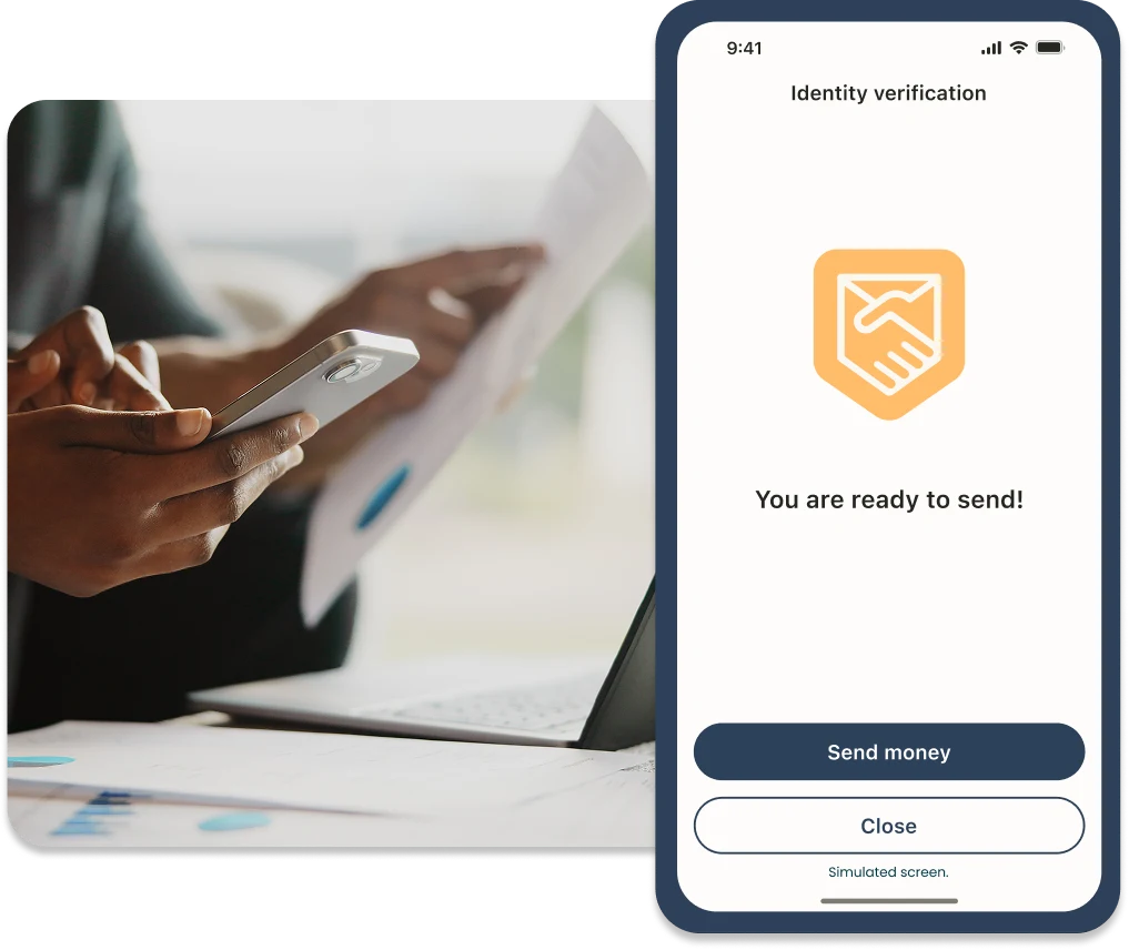 Business owner with paperwork and a phone showing an identity-verification screen