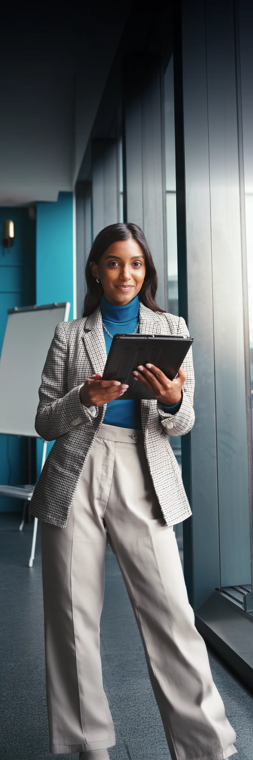 Business owner reviewing payments on a tablet